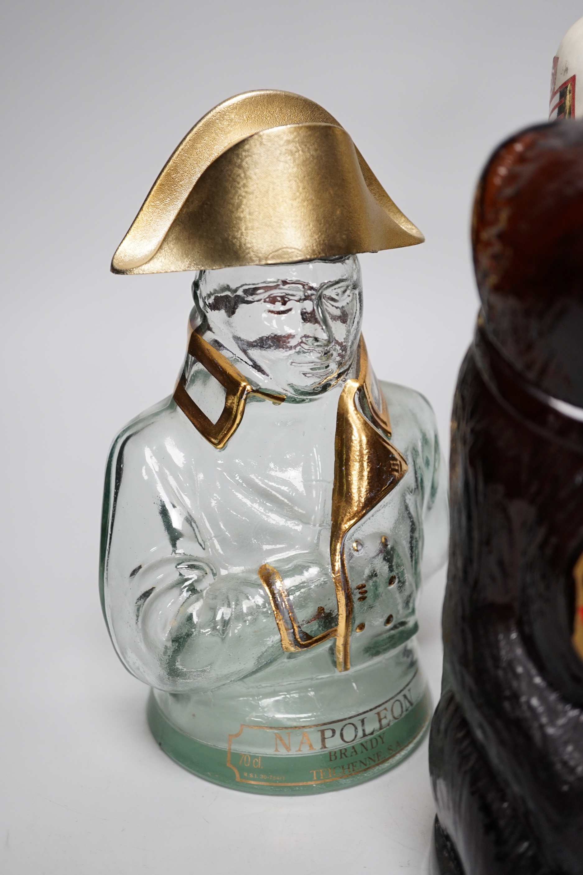Five novelty empty flasks including Napoleon brandy and Cossack vodka